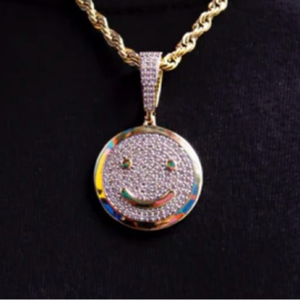 Reversible smile frown pendant GLD brand